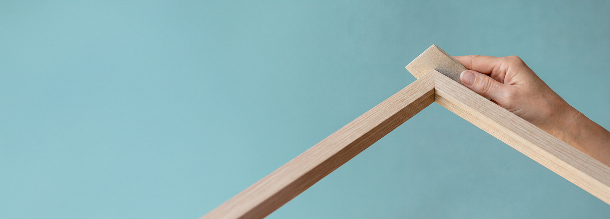 Hands assembling a timber frame